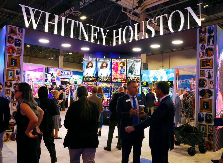 IGT's Skyrise cabinets with Whitney Houston video slots are displayed at IGT booth at G2E Las V ...