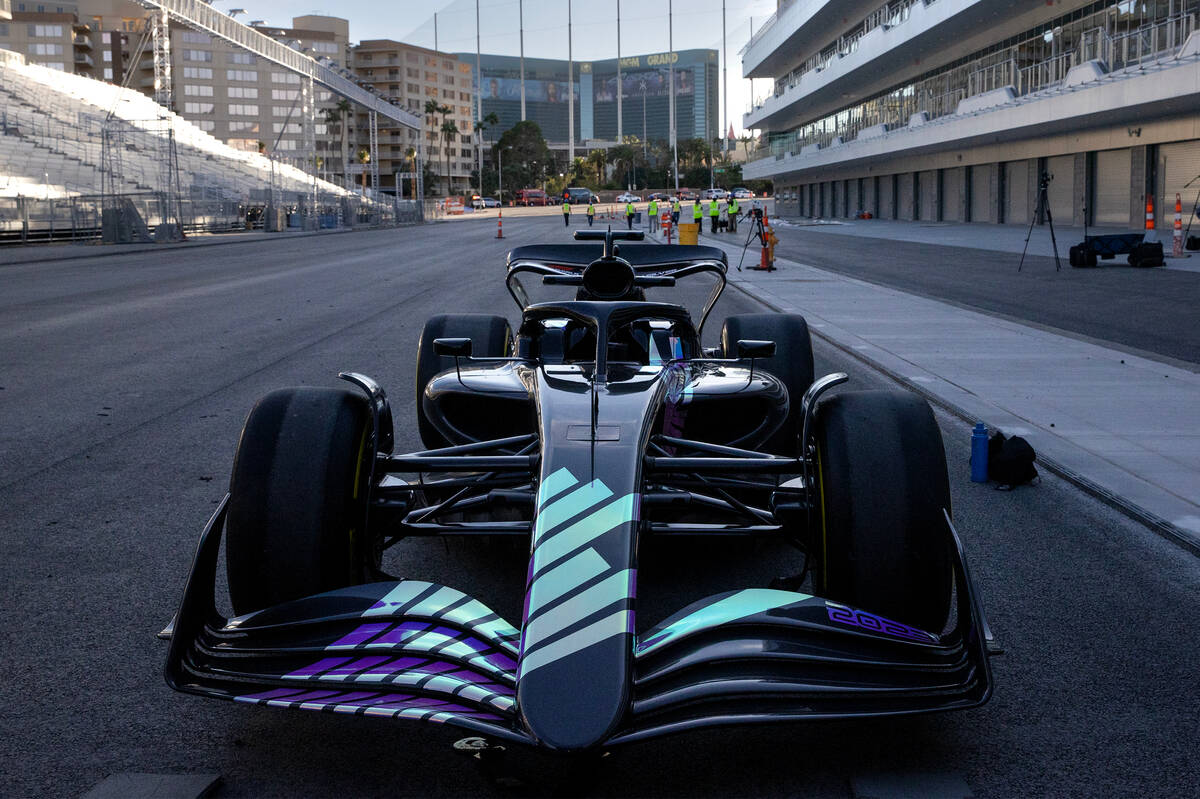 A Formula One show car is transported from the F1 Pit Building after a news conference on Tuesd ...