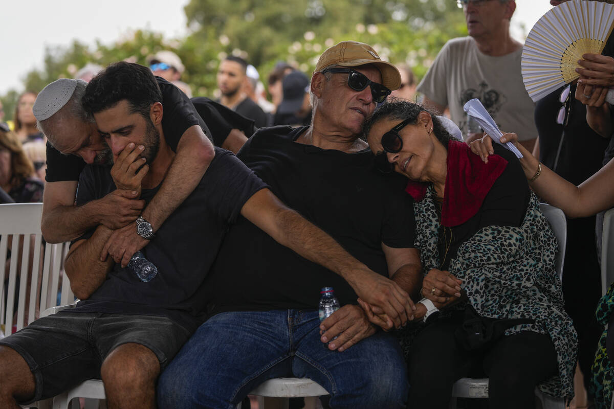 Mourners attend the funeral of May Naim, 24, during her funeral in Gan Haim, Israel, on Wednesd ...