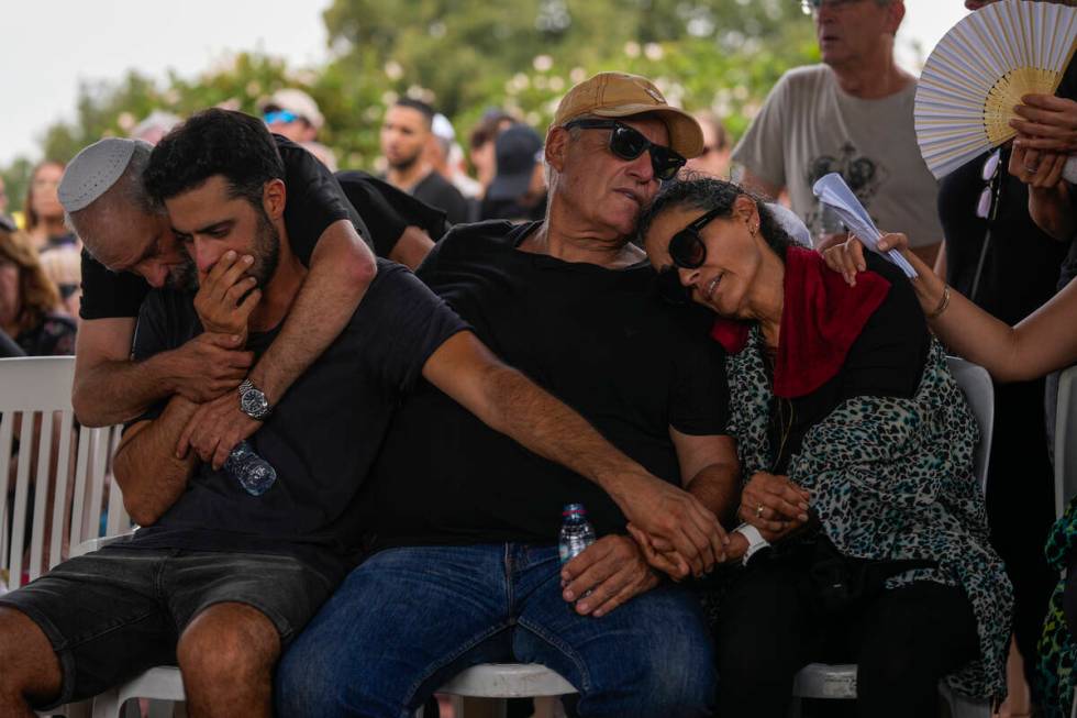 Mourners attend the funeral of May Naim, 24, during her funeral in Gan Haim, Israel, on Wednesd ...