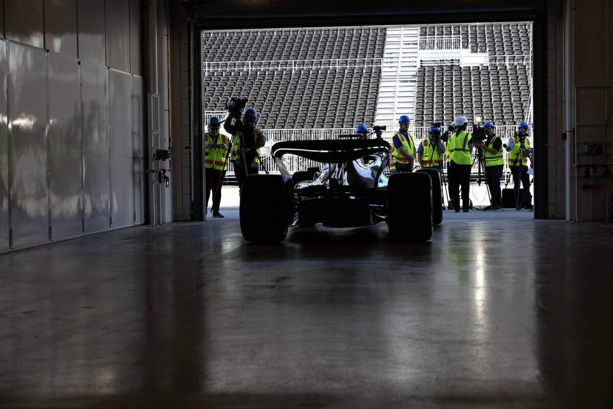 A Formula One show car is one display during a news conference at the F1 Pit Building on Tuesda ...