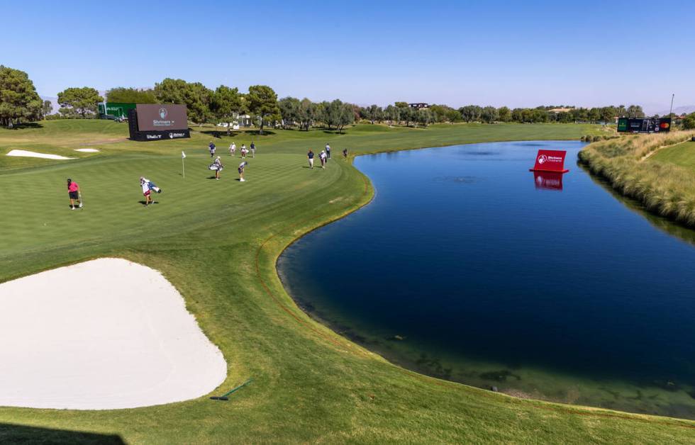 Golfers make their way to the green on hole 18 during the Pro Am before the Shriners Children's ...