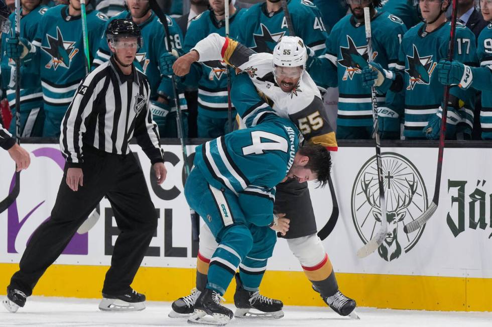 Vegas Golden Knights right wing Keegan Kolesar (55) fights with San Jose Sharks defenseman Kyle ...