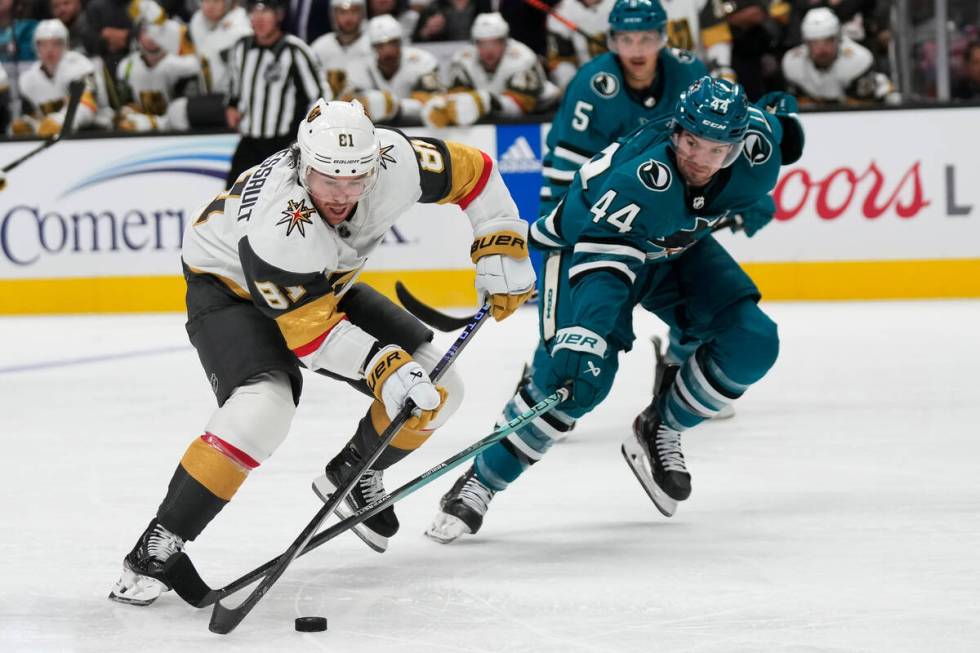 Vegas Golden Knights right wing Jonathan Marchessault, left, skates with the puck against San J ...