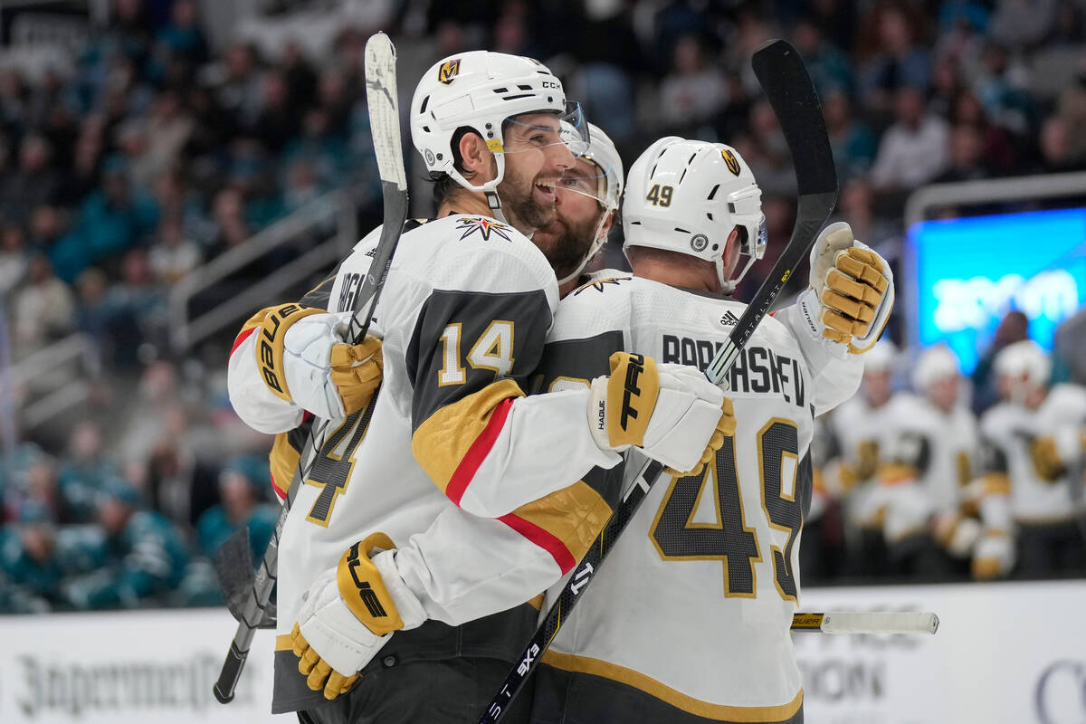 Vegas Golden Knights defenseman Nicolas Hague (14) is congratulated by teammates after his goal ...