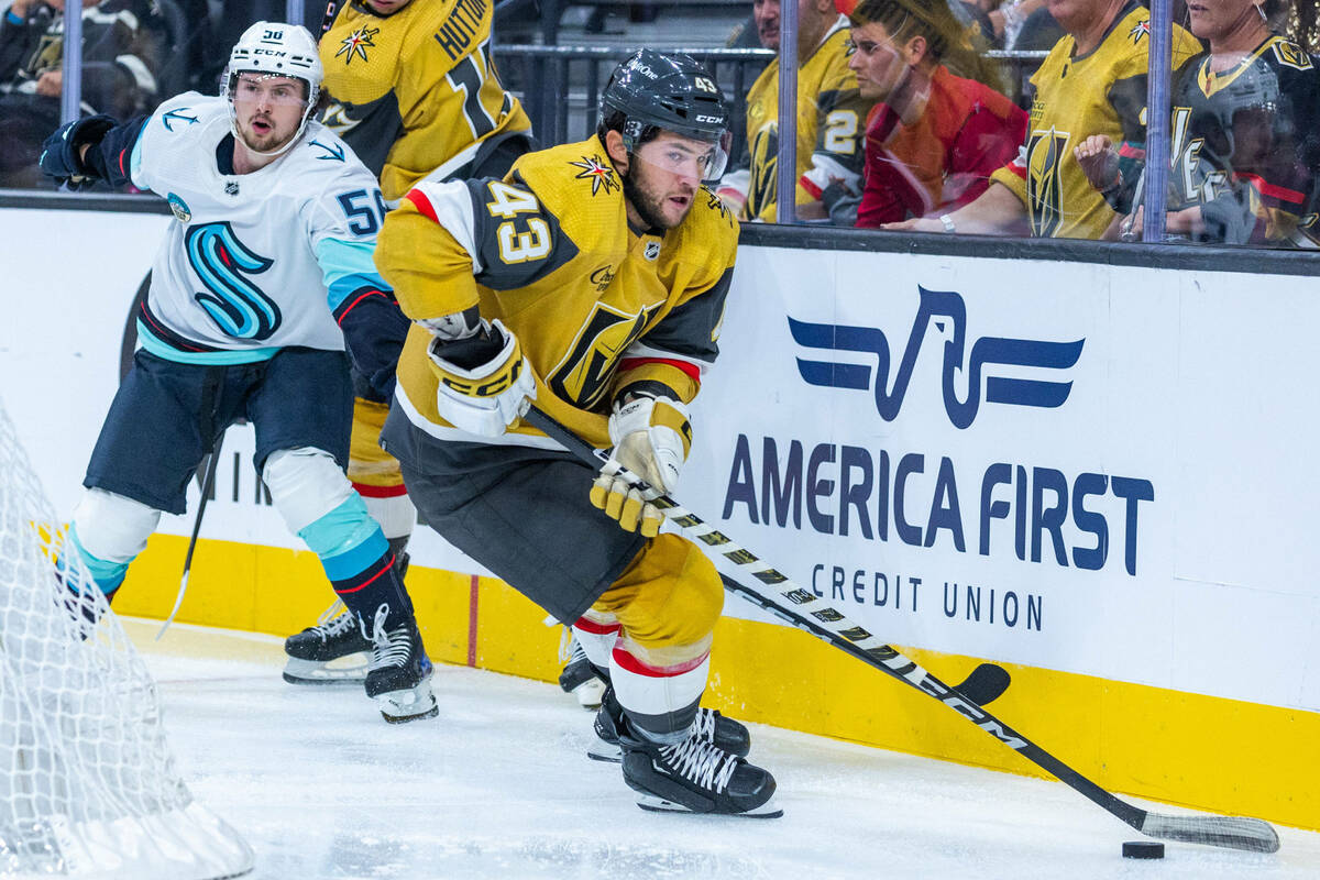 Golden Knights center Paul Cotter (43) looks to pass with Seattle Kraken right wing Kailer Yama ...