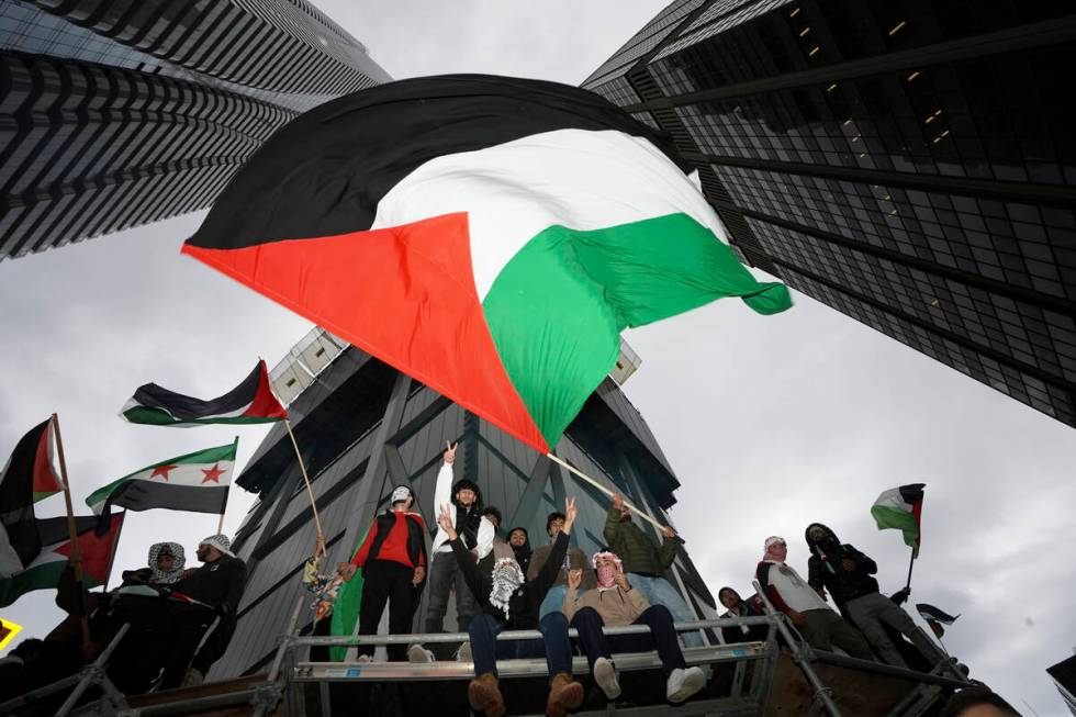 Supporters wave the Palestine flag at a march in Toronto, on Oct. 9, 2023. Before it transforme ...