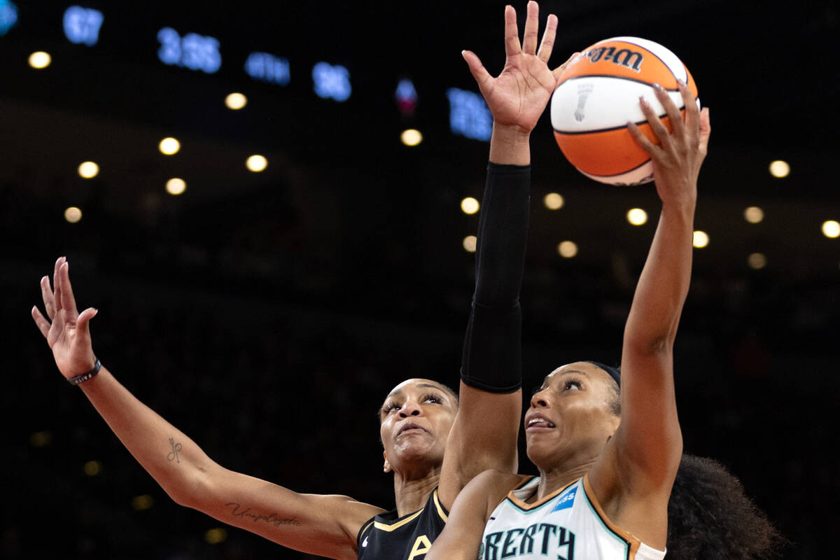 Las Vegas Aces forward A'ja Wilson (22) reaches to block against New York Liberty forward Betni ...