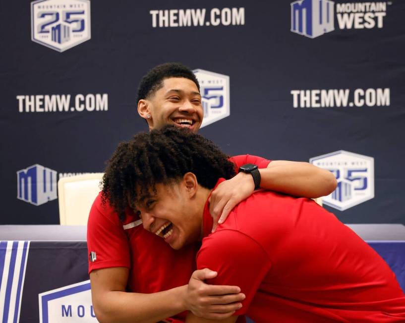 UNLV Rebels guard Justin Webster, left, and forward Jalen Hill jokingly wrestle before addressi ...