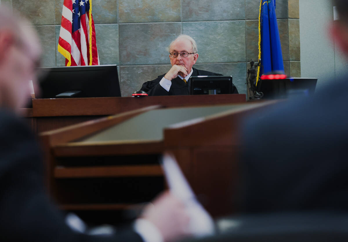 Clark County District Judge Mark Denton oversees a hearing regarding the Nevada Association of ...
