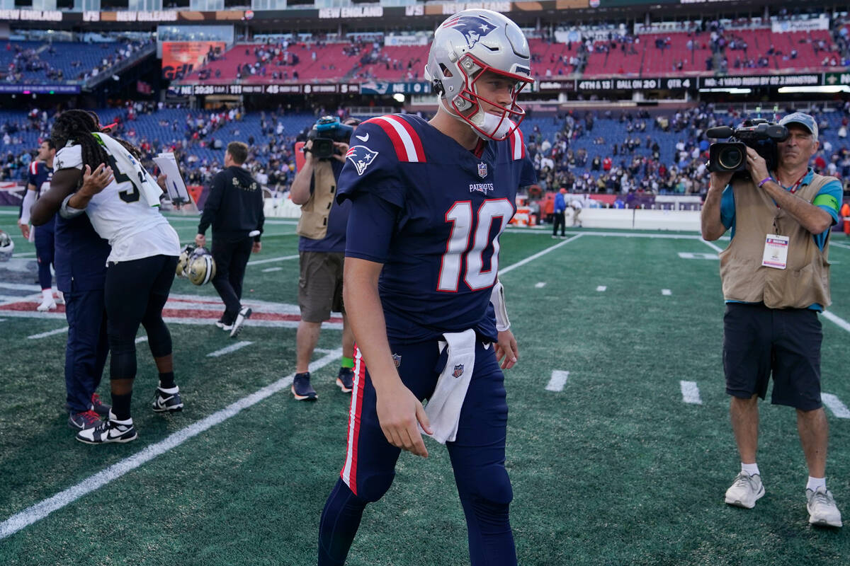 New England Patriots quarterback Mac Jones (10) after an NFL football game, Sunday, Oct. 8, 202 ...