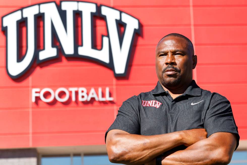 Former Rebel Hunkie Cooper, now a member of the staff, poses for a photo at Fertitta Football C ...