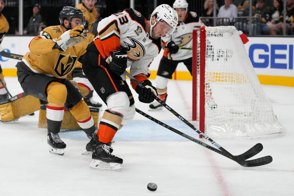 Anaheim Ducks center Mason McTavish (23) vies for the puck with Vegas Golden Knights center Nic ...