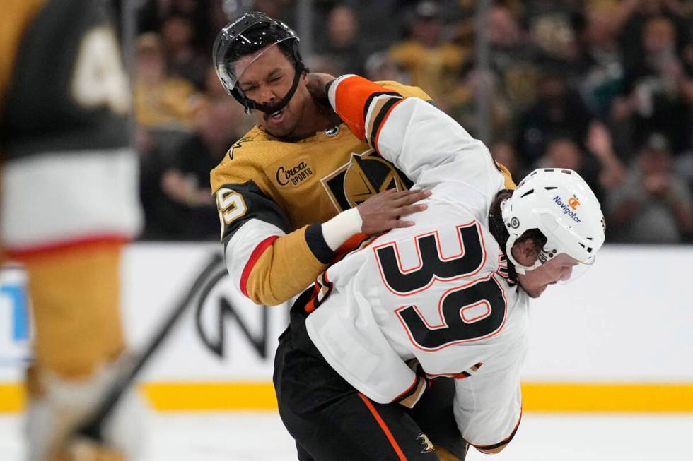 Vegas Golden Knights right wing Keegan Kolesar (55) and Anaheim Ducks center Sam Carrick (39) f ...