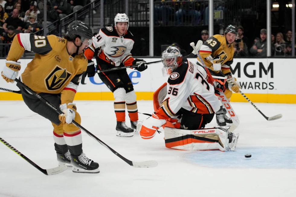 Vegas Golden Knights center Chandler Stephenson (20) scores past Anaheim Ducks goaltender John ...