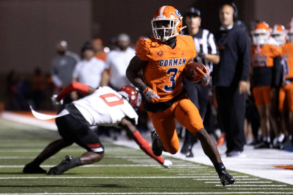 Bishop Gorman’s Devon Rice (3) runs the ball before scoring a touchdown after Centennial ...