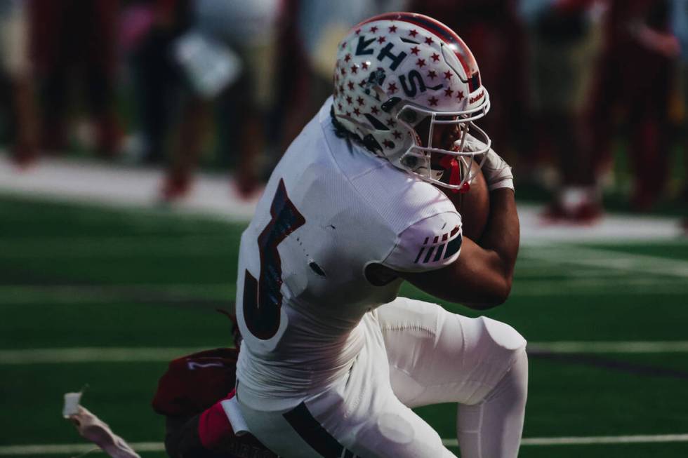 Liberty running back Isaiah Lauofo (3) tries to force himself into the end zone during a game a ...