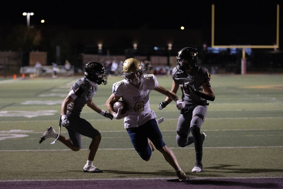 Foothill wide receiver Ethan Stubbs (6) runs into the end zone for a touchdown between Faith Lu ...