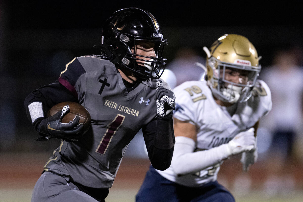 Faith Lutheran wide receiver Griffin Carty (1) runs for a touchdown while Foothill cornerback A ...