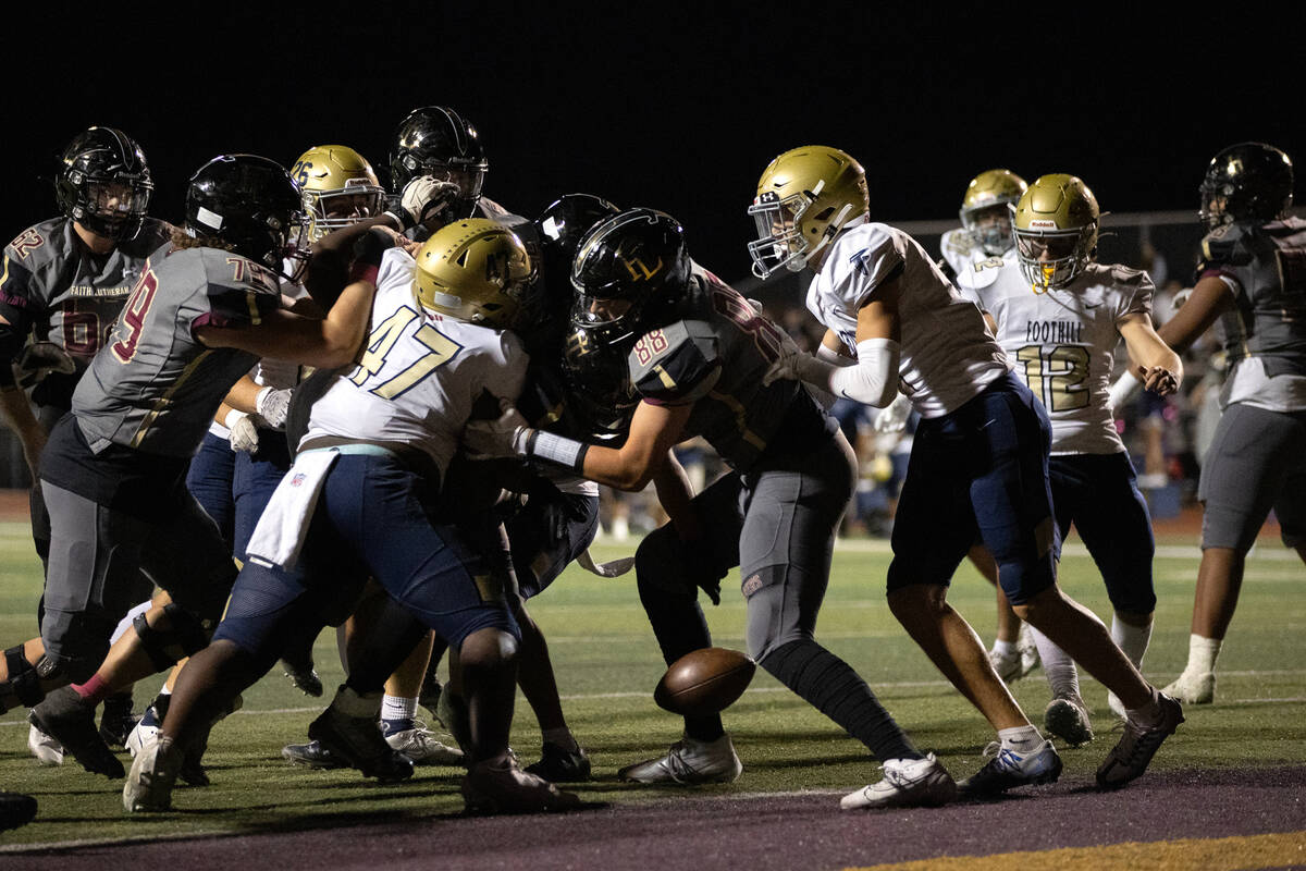 Faith Lutheran fumbles the ball near the end zone while Foothill’s defense moves to snag ...