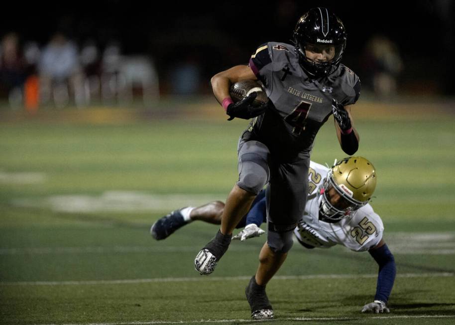 Faith Lutheran running back Sean Sampson (4) runs toward the end zone while Foothill strong sa ...