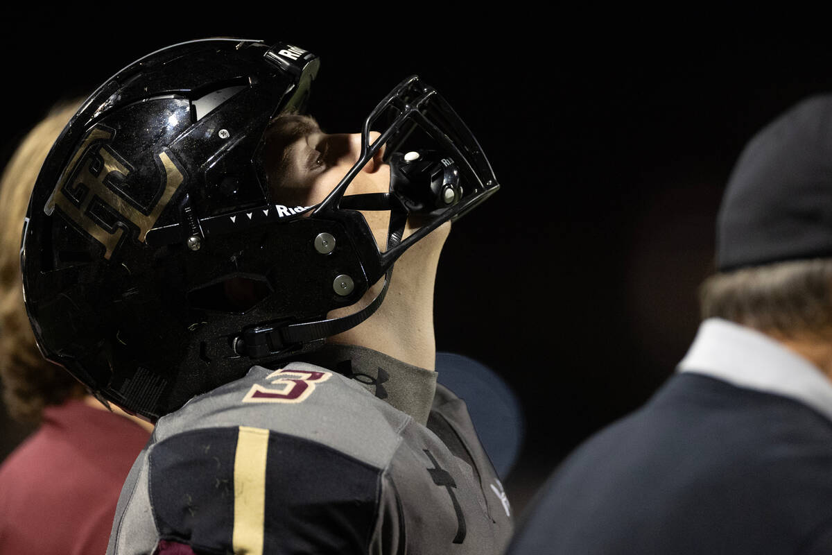 Faith Lutheran quarterback Garyt Odom (3) reacts on the sidelines after his team was called for ...