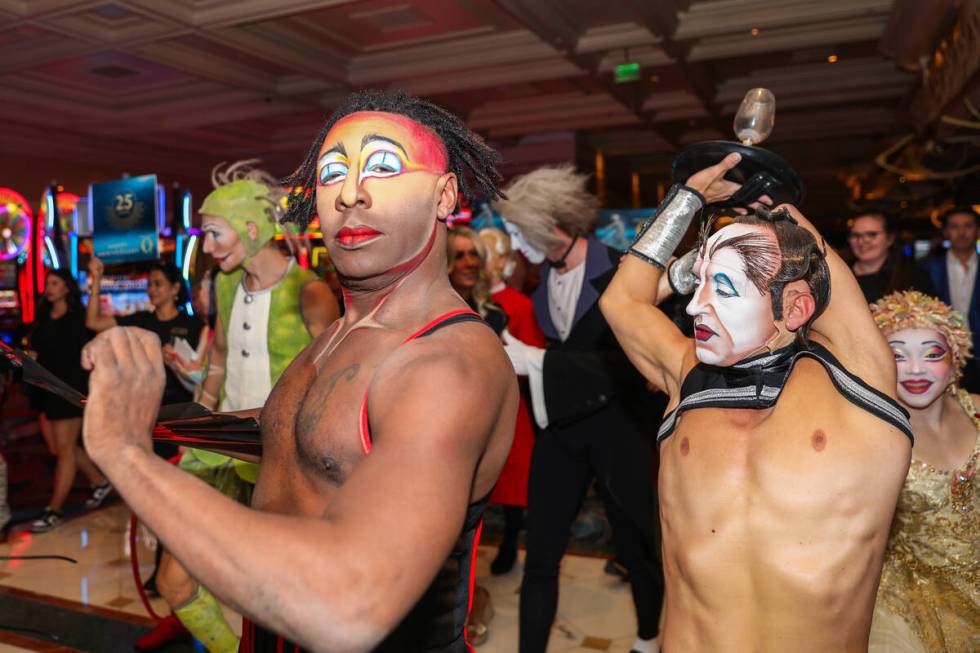 Cirque du Soleil performers walk through the Bellagio as part of the “O” annivers ...