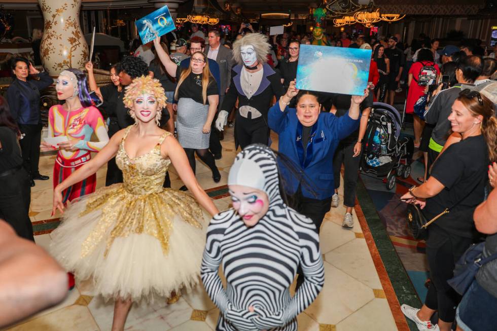 Bellagio guests watch as Cirque du Soleil performers and ushers walk in the “O” a ...