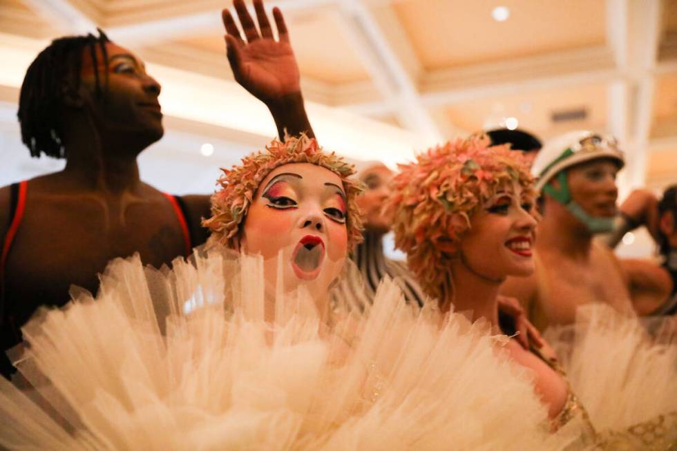 Cirque du Soleil performers walk through the Bellagio as part of the “O” annivers ...