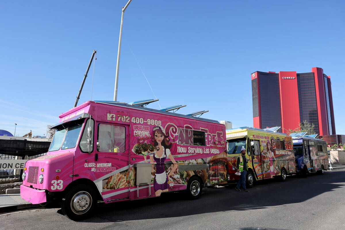 Food trucks serve customers on Elvis Presley Boulevard near the Strip in Las Vegas on Friday, O ...