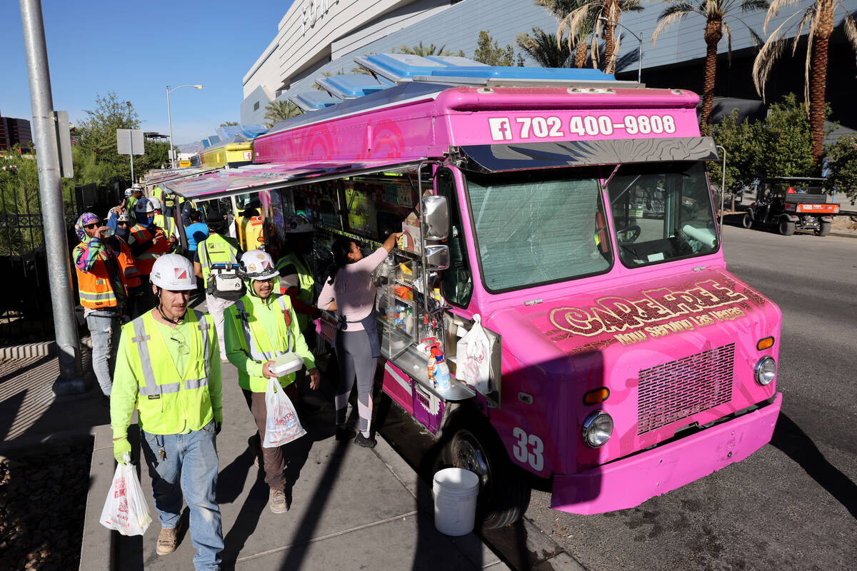 Food trucks serve customers on Elvis Presley Boulevard near the Strip in Las Vegas on Friday, O ...
