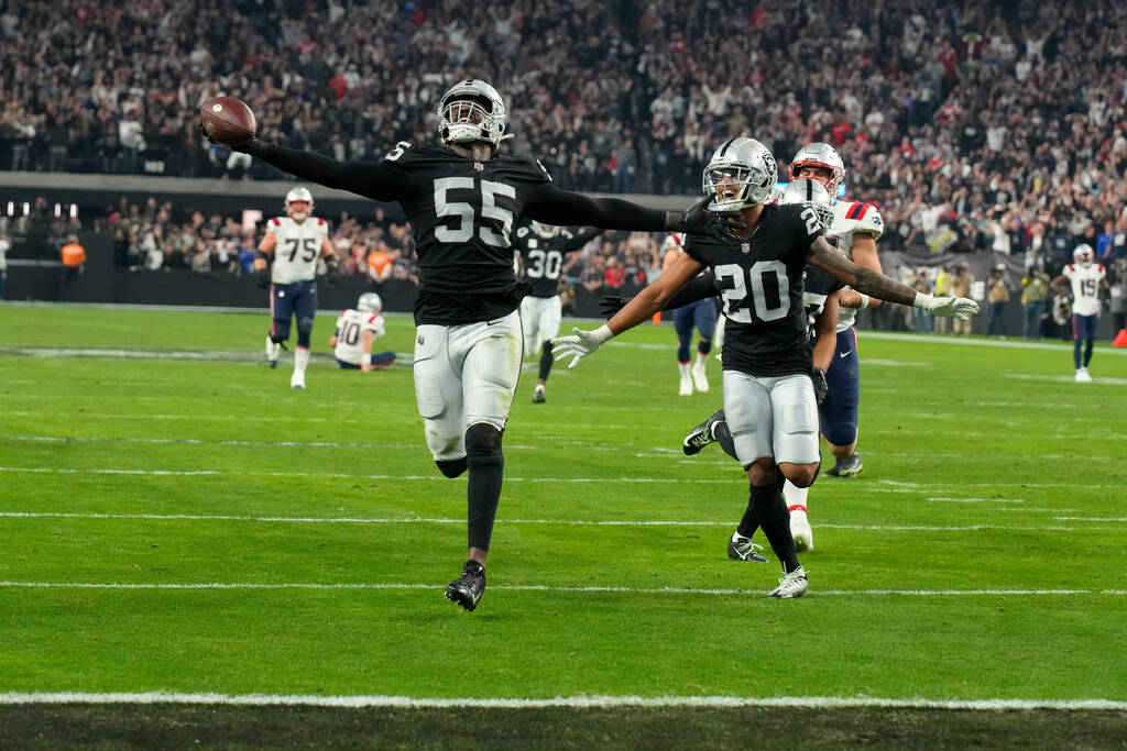 Las Vegas Raiders defensive end Chandler Jones (55) scores a touchdown against the New England ...