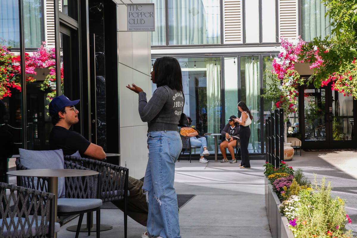 People hang out at The Pepper Club, which is part of the Midtown development, on Friday, Oct. 1 ...