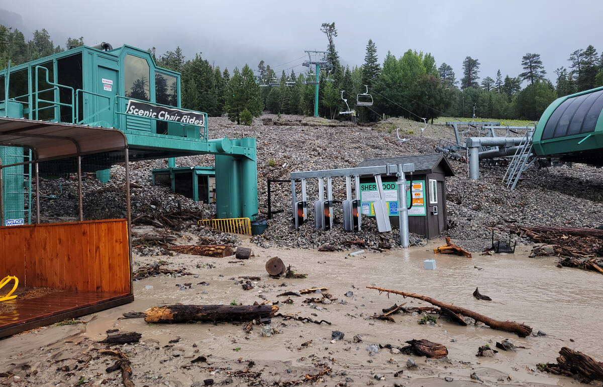 Thousands of tons of rock and debris at a Lee Canyon chairlift following Tropical Storm Hilary ...