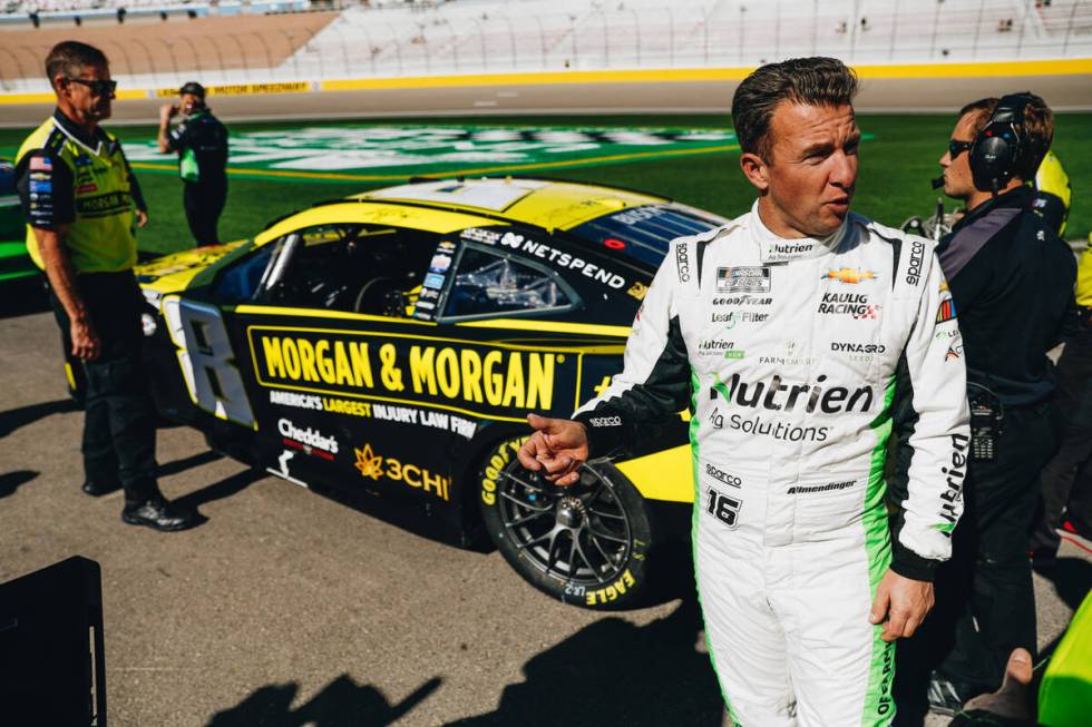 AJ Allmendinger walks to his car to practice for the NASCAR Cup Series South Point 400 at the L ...