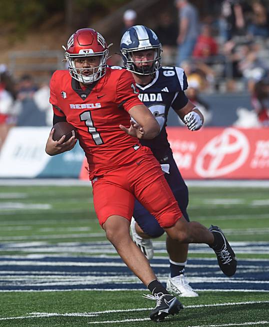 UNLV’s Jayden Maiava looks to run while taking on Nevada at Mackay Stadium in Reno on Oct. 14 ...