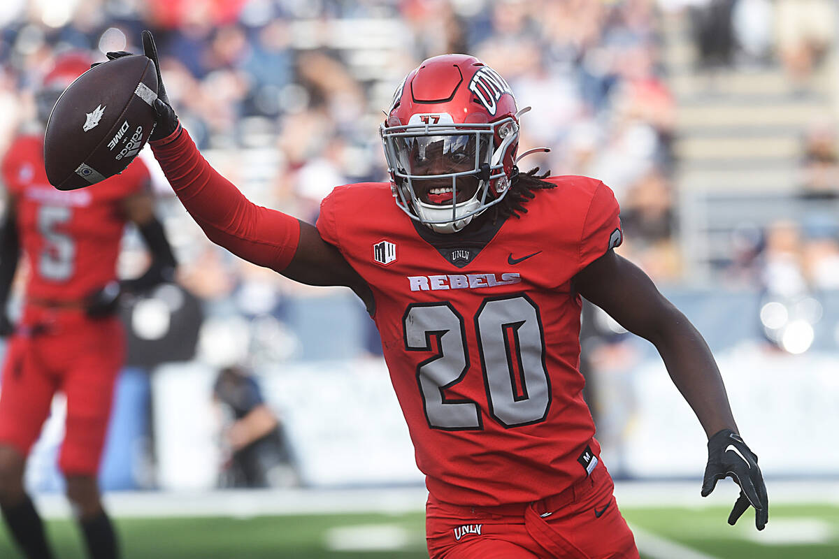 UNLV’s Trenton Holloway celebrates after securing a turnover while taking on Nevada at Mackay ...