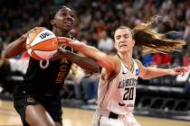 New York Liberty guard Sabrina Ionescu (20) attempts to stop Las Vegas Aces guard Jackie Young ...