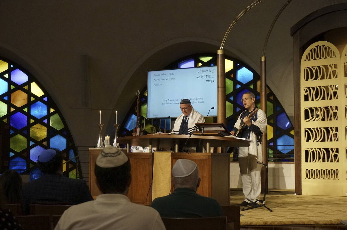 Cantor Juval Porat, right, and Rabbi Robert Davis lead Shabbat services at Temple Beth Sholom i ...