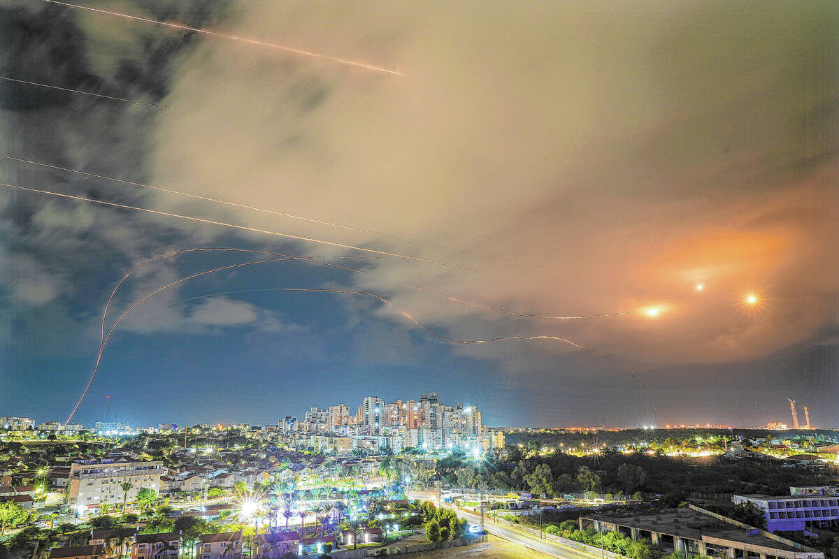 Israeli Iron Dome air defense system fires to intercept a rocket fired from the Gaza Strip, in ...