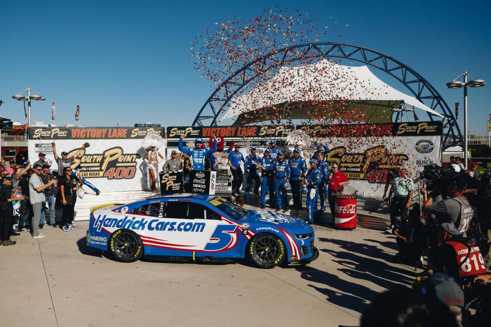 Kyle Larson celebrates on top of his car after winning the South Point 400 at the Las Vegas Mot ...