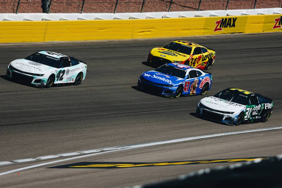 Race cars speed throughout the track during the South Point 400 at the Las Vegas Motor Speedway ...