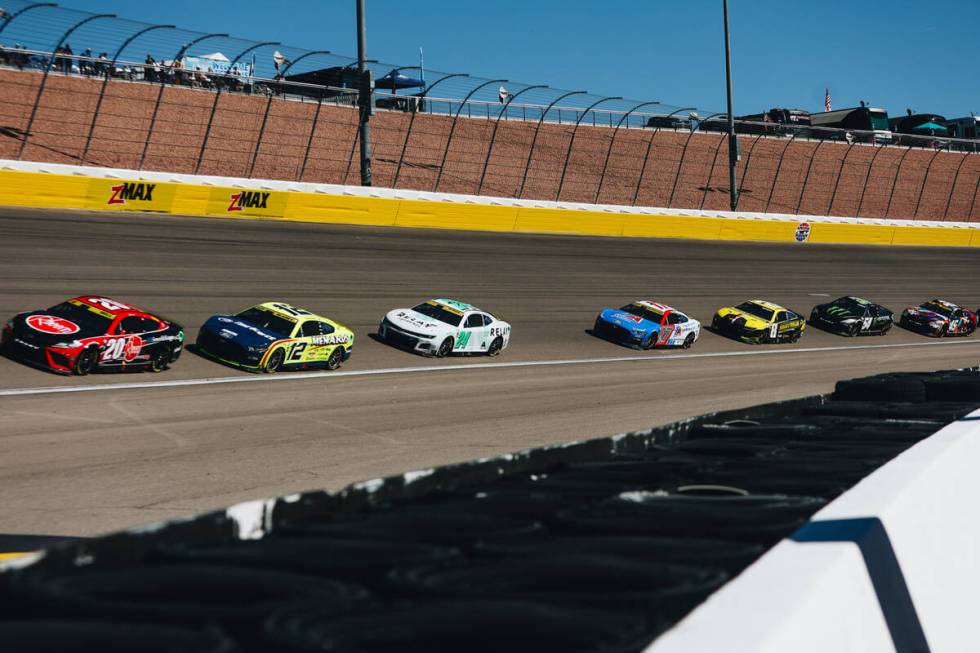 Race cars speed throughout the track during the South Point 400 at the Las Vegas Motor Speedway ...