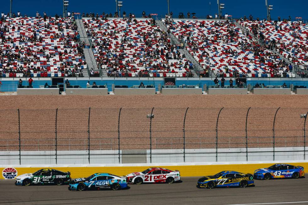 Race cars speed throughout the track during the South Point 400 at the Las Vegas Motor Speedway ...