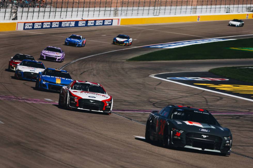 Race cars speed throughout the track during the South Point 400 at the Las Vegas Motor Speedway ...