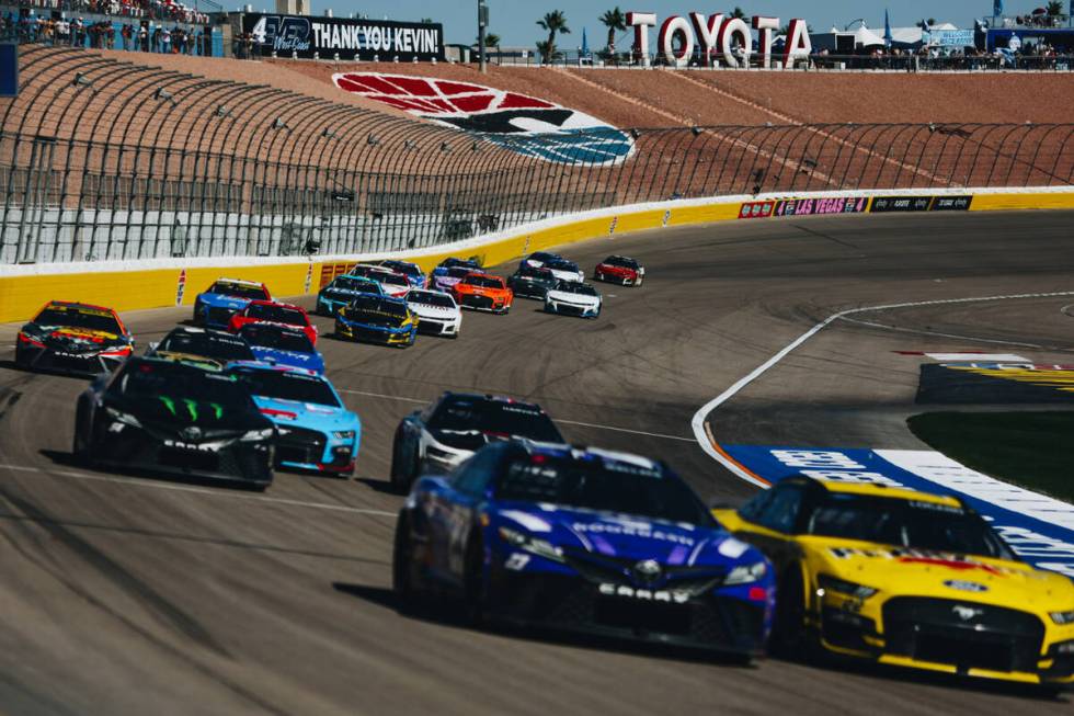 Race cars speed throughout the track during the South Point 400 at the Las Vegas Motor Speedway ...