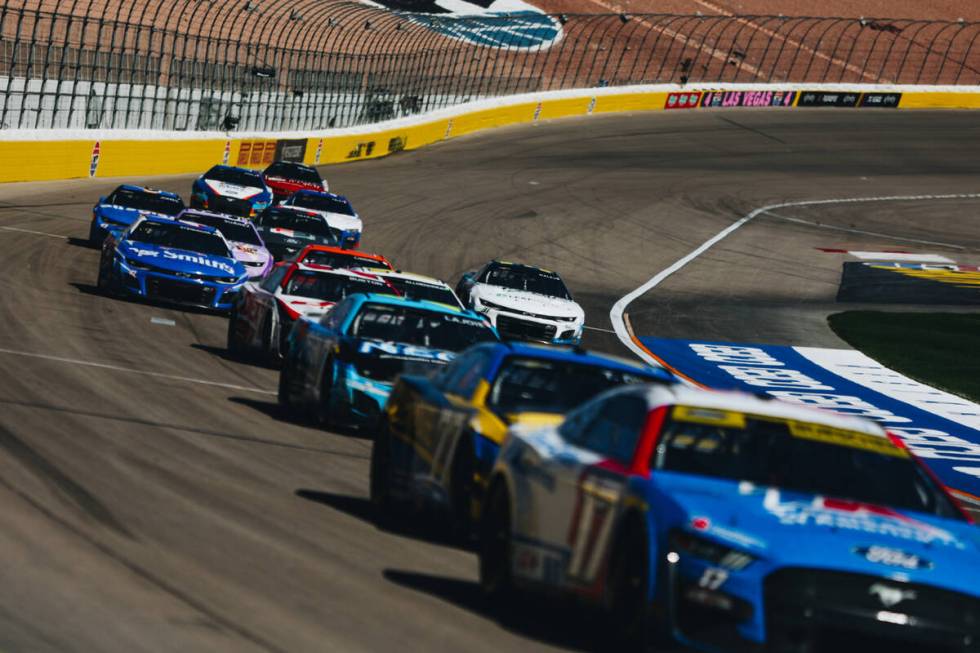 Race cars speed throughout the track during the South Point 400 at the Las Vegas Motor Speedway ...