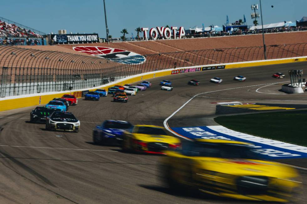 Race cars speed throughout the track during the South Point 400 at the Las Vegas Motor Speedway ...