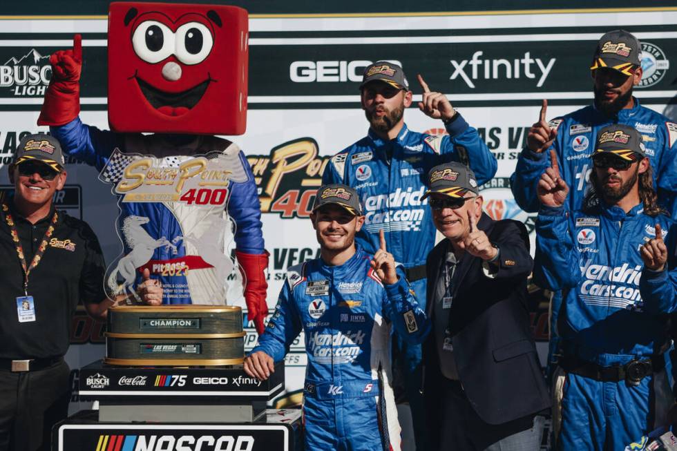 Kyle Larson poses with a trophy after winning the South Point 400 at the Las Vegas Motor Speedw ...