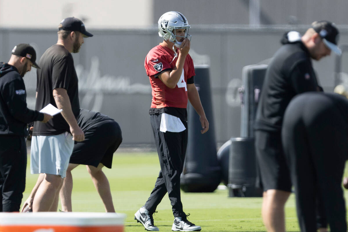 Raiders quarterback Aidan O'Connell (4) works through drills during team practice at the Interm ...